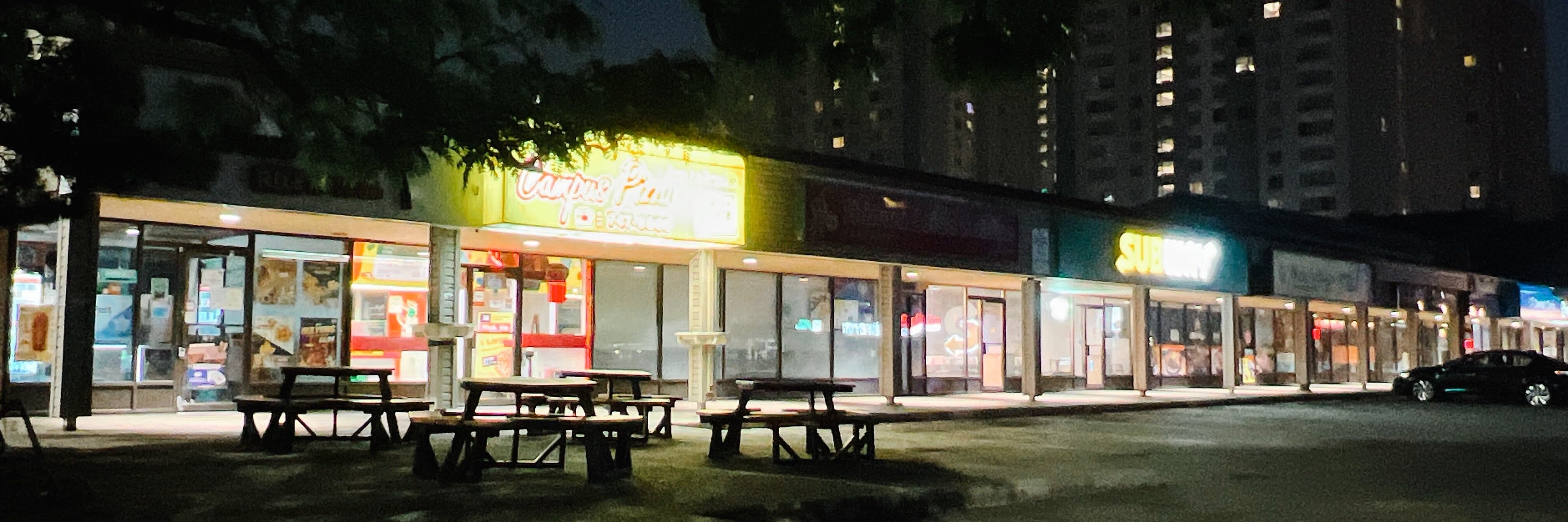 A low-res preview of a wide shot of a pizza in a plaza